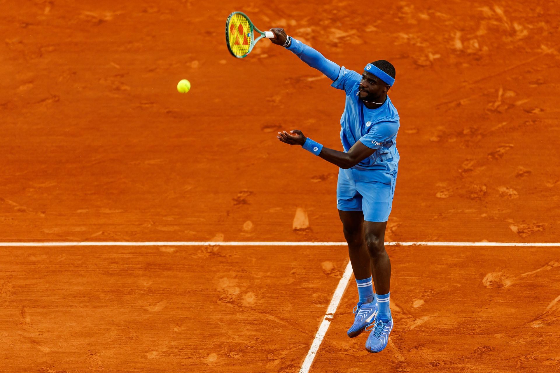 Tiafoe plays an overhead smash at the 2025 French Open - Day Eight - Source: Getty